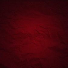 Dark red background with uneven spots and vignetting. Crumpled thick paper texture. Blood red color. Dark frame around the edges.